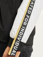 vsct Coach - Cortavientos con cinta del logotipo original