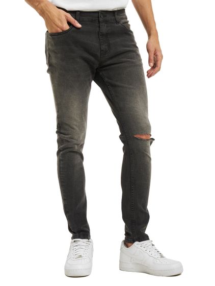 Jean skinny délavé à déchirures Criminal Damage, gris