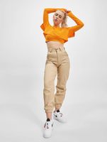 Le haut court Couture Club avec un imprimé gothique superposé en orange