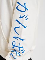 Sudadera Fokus x Def para hombre con bolsillo tipo canguro y varios estampados en blanco o negro