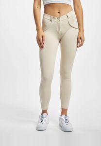 Pantalones elásticos versátiles Freddy para mujer con cremallera, de algodón, color beige.
