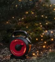 Guirlande lumineuse d'extérieur Konstsmide, sur enrouleur de câble, 7 mètres, 100 LED, Ambre, étanche IP44, Noir/Rouge