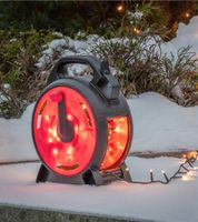 Guirlande lumineuse d'extérieur Konstsmide, sur enrouleur de câble, 7 mètres, 100 LED, Ambre, étanche IP44, Noir/Rouge