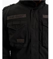Veste de terrain Brandit M65 Giant, robuste et élégante, idéale pour la mi-saison. Veste en coton avec capuche, référence B3101, coloris noir ou bleu marine.