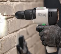 BLACK+DECKER 12V Cordless Hammer Drill for drilling into masonry and concrete; integrated 1.5Ah battery **B-Stock – tested & fully functional** REVHD12C Black/White